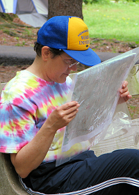Deb Samans planning route choice at the SVO Memorial Day Rogaine, photo by Julie Keim