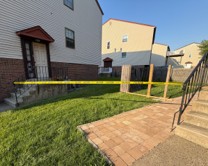 yellow tape in the terrain where artificial barriers are located